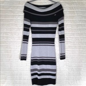 A striped, shiny, tight, holiday dress.